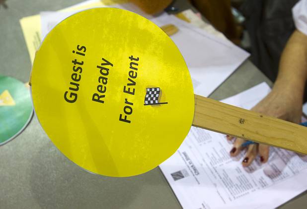 A sign signals a guest is finished with their check-in during the Fall 2013 Southern Nevada Project Homeless Connect at Cashman Field Center Tuesday, Nov. 19, 2013. The annual event brings together a variety of social and legal services to help homeless and low-income people.