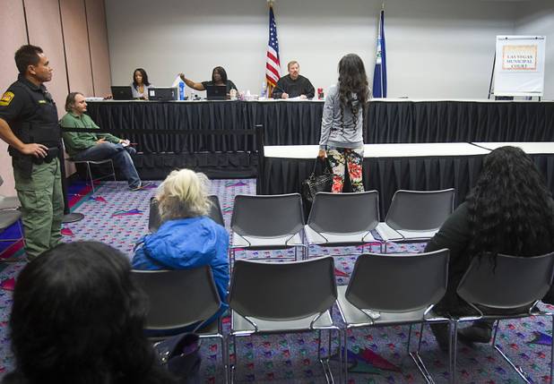Shane Emerick listens to a woman during the Fall 2013 Southern Nevada Project Homeless Connect at Cashman Field Center Tuesday, Nov. 19, 2013. The annual event brings together a variety of social and legal services to help homeless and low-income people.