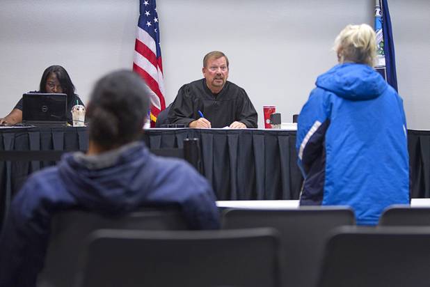 Shane Emerick listens to a woman during the Fall 2013 Southern Nevada Project Homeless Connect at Cashman Field Center Tuesday, Nov. 19, 2013. The annual event brings together a variety of social and legal services to help homeless and low-income people.