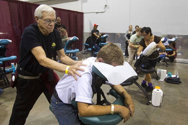 Paul Lofgreen, a massage therapist with Mountain Top Wholeness Center, gives a chair massage during the Fall 2013 Southern Nevada Project Homeless Connect at Cashman Field Center Tuesday, Nov. 19, 2013. The annual event brings together a variety of social and legal services to help homeless and low-income people.
