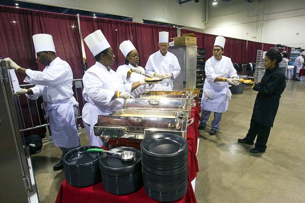 Culinary Academy of Las Vegas students serve food during the Fall 2013 Southern Nevada Project Homeless Connect at Cashman Field Center Tuesday, Nov. 19, 2013. The annual event brings together a variety of social and legal services to help homeless and low-income people.