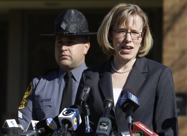 Virginia State Police spokeswoman, Corinne Geller, right, briefs the press during a news conference in Charlottesville, Va., Tuesday, Nov. 19, 2013. Geller confirmed that Virginia State Senator Creigh Deeds was stabbed multiple times and his son was killed at Deeds' home in Bath County, Va., during a Tuesday morning assault.