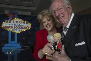 Las Vegas Mayor Carolyn Goodman, left, poses for portrait with predecessor and husband, former Mayor Oscar Goodman, Nov. 21, 2013, with their bobble head dolls.