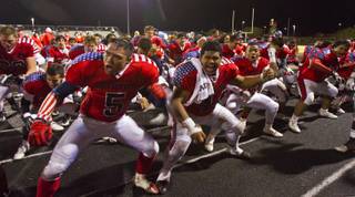 Liberty High School football players during a Samoan Haka dance at their playoff game versus Green Valley on Friday, Nov. 22, 2013.