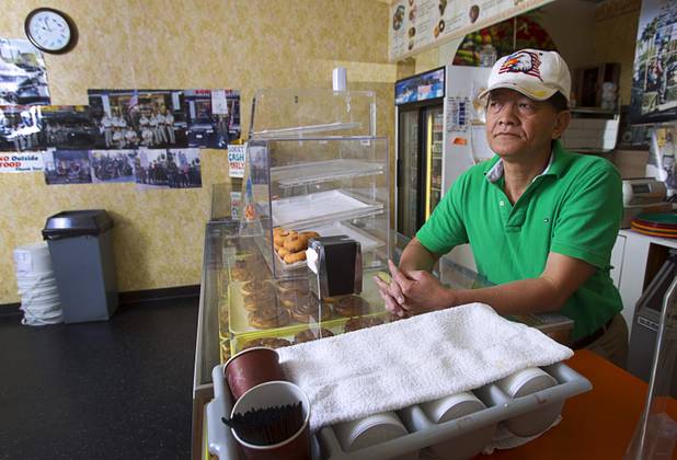 Sothy Seang, 57, waits for customers at the Donut Hut, 3242 E Desert Inn Rd., Sunday, Nov. 24, 2013. Seang fought with the Cambodian army against the Viet Cong during the Vietnam War. He later immigrated to the U.S. He has owned the Donut Hut in Las Vegas for 22 years.