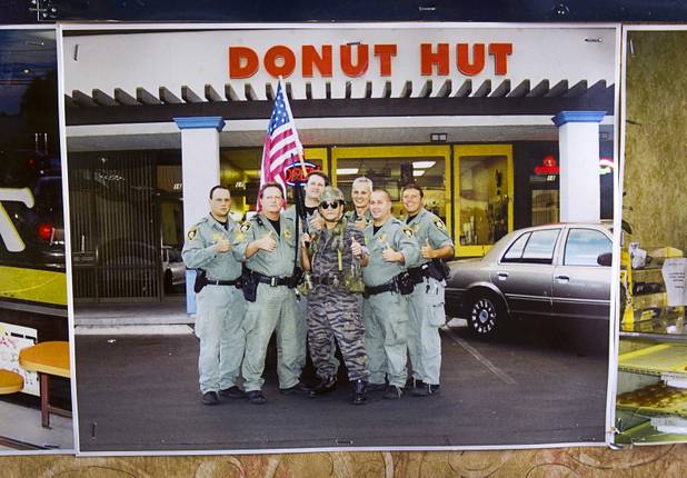 Sothy Seang is shown in a photo posing with Metro Police officers at the Donut Hut, 3242 E Desert Inn Rd., Sunday, Nov. 24, 2013. Seang fought with the Cambodian army against the Viet Cong during the Vietnam War. He later immigrated to the U.S. He has owned the Donut Hut in Las Vegas for 22 years.