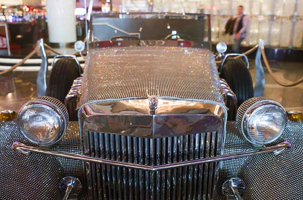 A  rhinestone-covered roadster, once owned by Liberace, is displayed in the Cosmopolitan Monday, Nov. 25, 2013. The display is part of "Too Much of a Good Thing Is Wonderful: Liberace and the Art of Costume" in the Cosmopolitan opened Monday and will run through Jan.1, 2014. Admission is free but any donations will benefit the Liberace Foundations scholarship fund.