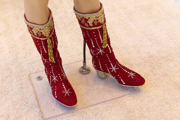 Boots, part of a costume worn by Liberace, are displayed at "Too Much of a Good Thing Is Wonderful: Liberace and the Art of Costume" in the Cosmopolitan Monday, Nov. 25, 2013. The exhibit opened Monday and will run through Jan.1, 2014. Admission is free but any donations will benefit the Liberace Foundations scholarship fund.
