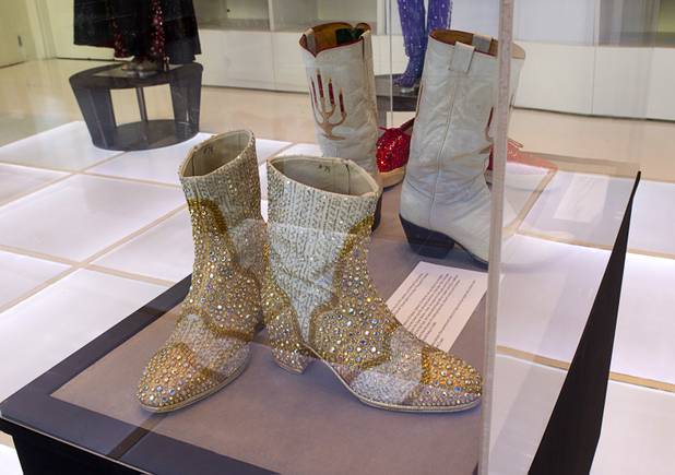 Boots, formerly owned by Liberace, are displayed at "Too Much of a Good Thing Is Wonderful: Liberace and the Art of Costume" in the Cosmopolitan Monday, Nov. 25, 2013. The exhibit opened Monday and will run through Jan.1, 2014. Admission is free but any donations will benefit the Liberace Foundations scholarship fund.