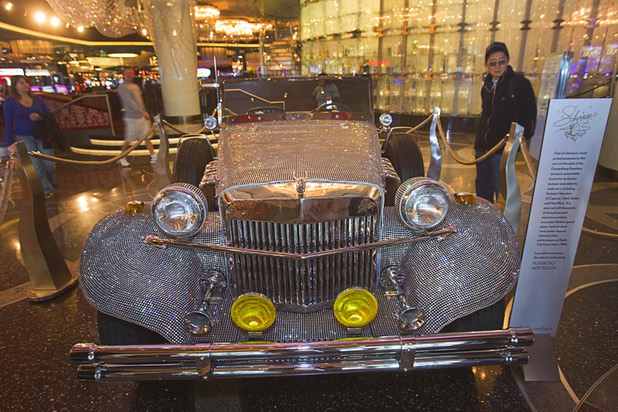 A  rhinestone-covered roadster, once owned by Liberace, is displayed in the Cosmopolitan Monday, Nov. 25, 2013. The display is part of "Too Much of a Good Thing Is Wonderful: Liberace and the Art of Costume" in the Cosmopolitan opened Monday and will run through Jan.1, 2014. Admission is free but any donations will benefit the Liberace Foundations scholarship fund.