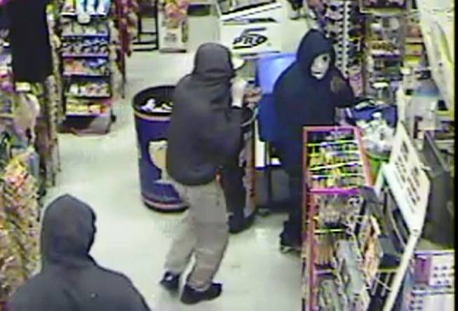 Three masked suspects rob business