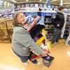 Teresa Sterner of Seven Valleys, Pa. decided not to use a cart during her visit to Toys R' Us during Black Friday shopping in York, Pa. on Thursday, Nov. 28, 2013.