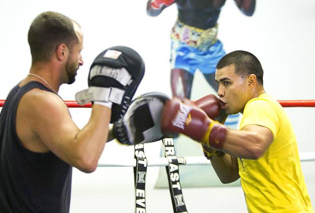Bronson Stultz, right, of Henderson, works on his timing with Chris Ben Tchavtchavadze during a workout at the Pochiro Boxing gym Tuesday, Dec. 3, 2013. Pochiro Boxing Promotions will hold a boxing card featuring local boxers at Sam's Town Friday. Stultz will face Wilberth Lopez of Tucson, Ariz., in a four-round welterweight bout.