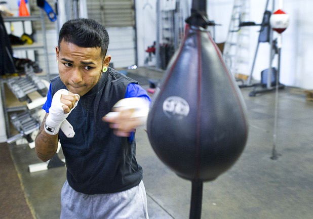 Boxer Yosigey Ramirez, 23, a graduate of Clark High School, hits a double-end bag during a workout at the Pochiro Boxing gym Tuesday, Dec. 3, 2013. Pochiro Boxing Promotions will hold a boxing card featuring local boxers at Sam's Town Friday.