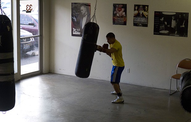 Bronson Stultz of Henderson hits a heavy bag during a workout at the Pochiro Boxing gym Tuesday, Dec. 3, 2013. Pochiro Boxing Promotions will hold a boxing card featuring local boxers at Sam's Town Friday. Stultz will face Wilberth Lopez of Tucson, Ariz., in a four-round welterweight bout.