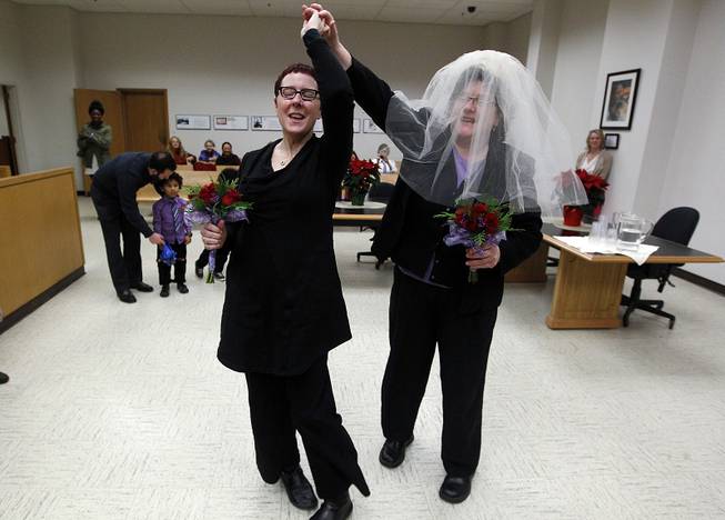 In this Dec. 9, 2012, photo, Cynthia Wallace and soon-to-be-wife Julie Fein spin a few dance steps as they prepare to take their wedding vows in the early morning hours in the courtroom of Judge Mary Yu in King County Courthouse in Seattle, becoming among the first gay couples in the state to legally wed.