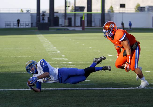Reed High School's Jake Lehmann (17) makes a diving touchdown catch during their Division I state high school football championship game against Bishop Gorman at Sam Boyd Stadium Saturday, Dec. 7, 2013.
