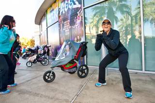 Instructor Jessica Peralta motivates moms to push themselves through their exercises during the Stoller Strides class, a program offered by FIT4MOM Las Vegas, at Town Square Mall in Las Vegas Friday morning, December 6, 2013.
