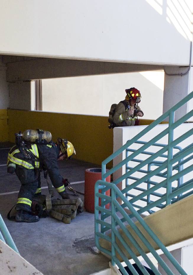 Firefighters from the North Las Vegas Fire Department prepare for a drill during training exercises in the Fiesta Casino parking garage Monday morning, Dec. 9, 2013.