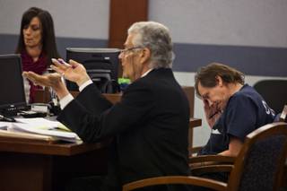 Defense attorney John Momot presents an argument for Melvyn Sprowson looking down during a preliminary hearing on Monday,  Dec. 9, 2013.