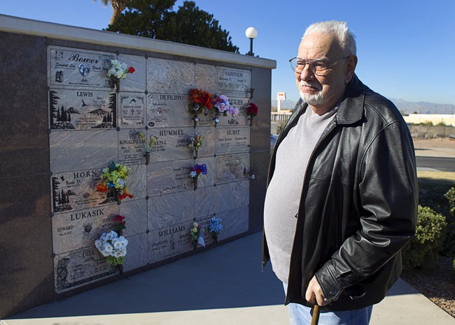 Frank Bower stands by an ashes wall at Palm Boulder ...