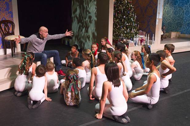 James Canfield, artistic director for Nevada Ballet Theater, gives instruction to party scene girls and boys during rehearsal for Nevada Ballet Theater’s “The Nutcracker” at the Smith Center for the Performing Arts on Wednesday, Dec. 11, 2013. The annual performance opens Saturday and runs through Dec. 22.
