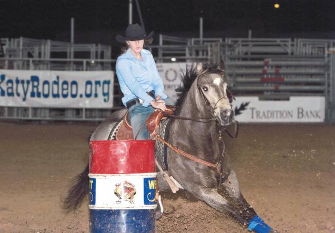Barrel racer Taylor Jacob and her horse Bo at Katy Rodeo.