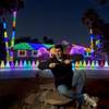 Hypnotist Marc Savard decks out his home with a light display for visitors and residents to view and admire Thursday, Dec. 12, 2013, in Las Vegas.