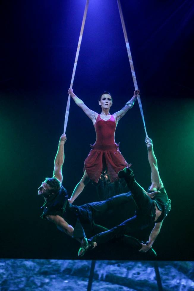 Erica Linz balances atop Kyle DesChamp and Pierre-Luc Sylvain during Circus Couture “Possession(s)” at the Joint in the Hard Rock Hotel on Sunday, Dec. 8, 2013. Linz is president and co-founder of Circus Couture.