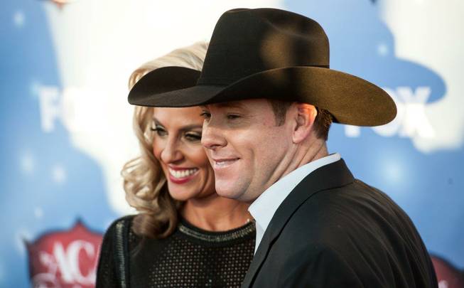 Trevor Brazile and his wife, Shada, arrive at the 2013 ...