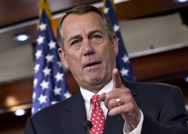 In this Dec. 12, 2013, photo, House Speaker John Boehner of Ohio rebukes conservative groups who oppose the pending bipartisan budget compromise struck by House Budget Committee Chairman Rep. Paul Ryan, R-Wis., and Senate Budget Committee Chairwoman Sen. Patty Murray, D-Wash., during a news conference on Capitol Hill in Washington.