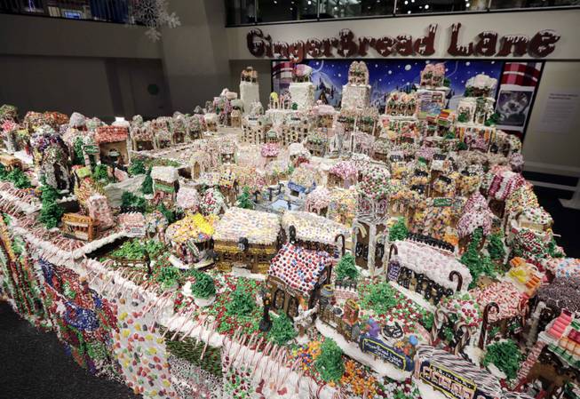 GingerBread Lane, created by Chef Jon Lovitch, is on display in the New York Hall of Science, in the Queens borough of New York, Thursday, Dec. 12, 2013. The 1.5-ton, 300-square-foot village that is made entirely of edible gingerbread, royal icing, and candy, has been acknowledged as the largest gingerbread village in the world by the 2014 Guinness World Records.
