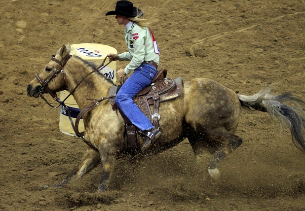Barrel racer Sherry Cervi approaches her first turn during the final evening of NFR racing at the Thomas & Mack Center on Saturday, Dec. 14, 2013.