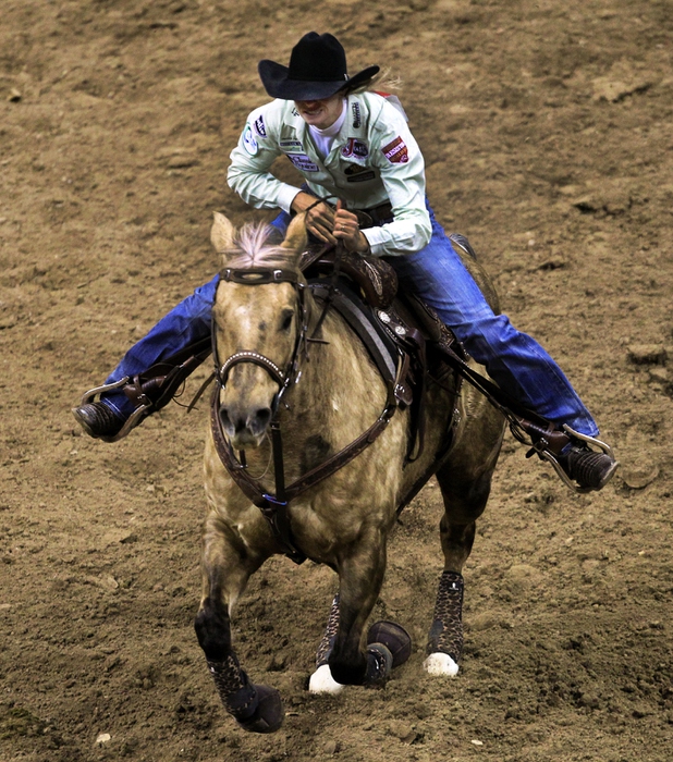 Barrel racer Sherry Cervi on her way to winning top honors during the final evening of NFR racing at the Thomas & Mack Center on Saturday, Dec. 14, 2013.
