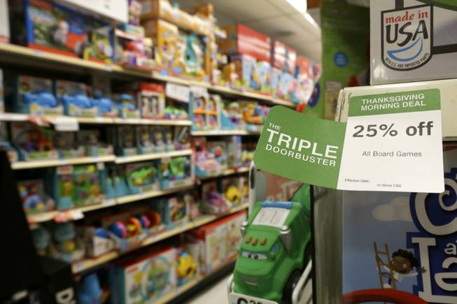 A "Triple Doorbuster" sale sign is placed at the toys section in Kmart on Thursday, Nov. 28, 2013, in New York. Sales are up 2 percent through Sunday, Dec. 15, 2013, according to data obtained by The Associated Press from store data tracker ShopperTrak, on Wednesday, Dec. 18, 2013, which declined to give dollar figures. The modest growth so far comes as the amount of discounting stores are doing is up 13 percent from last year, the highest level its been since 2008 when stores were holding huge sales events to draw in recession-weary shoppers, according to research firm BMO Capital Markets.