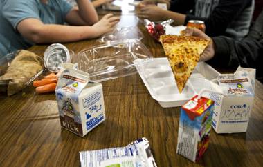 Pizza and other selections are eaten for lunch by students in the Greenspun Middle School cafeteria on Thursday, Dec. 19, 2013.