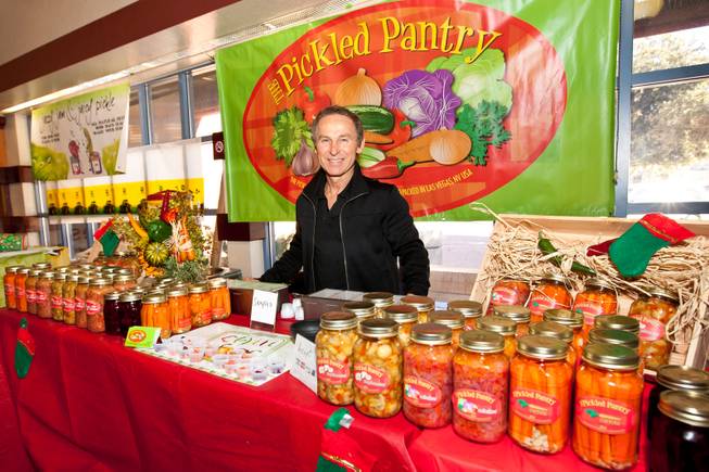 Nick Kreway is shown selling his pickled hot and spicy products from The Pickled Pantry booth at the Downtown Farmers' Market in Las Vegas Friday, December 20, 2013.