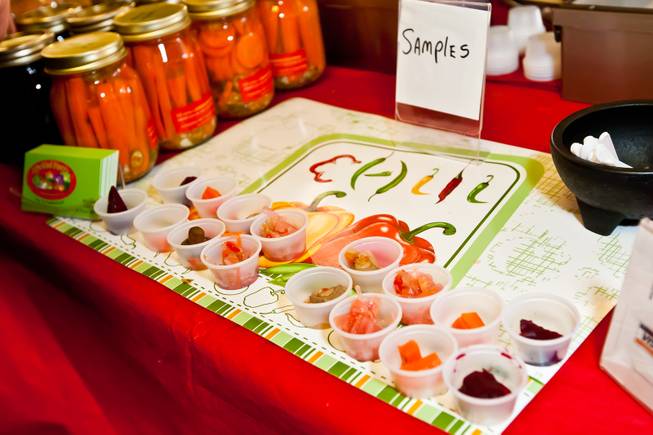 Samples of hot and spicy beets, carrots, coleslaw and mushrooms are offered to customers from The Pickled Pantry's booth at the Downtown Farmers' Market in Las Vegas Friday, December 20, 2013.