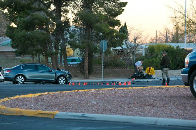 The scene of a fatal crash on Craig Road near Rainbow Boulevard is shown Thursday, Dec. 26, 2013.