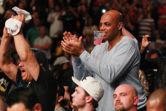 Former NBA player Charles Barkley cheers during the middleweight title fight between Chris Weidman and Anderson Silva at UFC 168 Saturday, Dec. 28, 2013 at the MGM Grand Garden Arena.