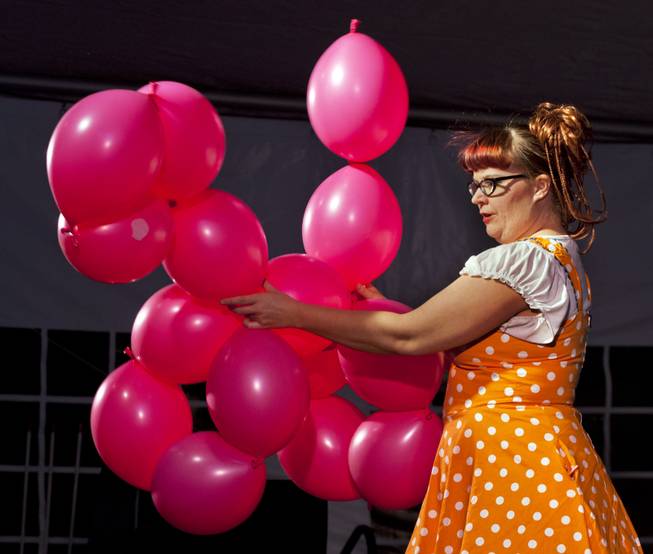 Tawney Bubbles creates a giant balloon dog during her unique act for a family variety show in the Magical Forest at Opportunity Village on Monday , Dec. 30, 2013. L.E. Baskow
