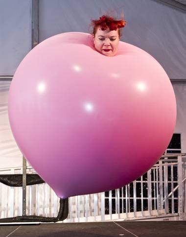 Tawney Bubbles leaps in the air from within a giant balloon during her unique act for a family variety show in the Magical Forest at Opportunity Village on Monday , Dec. 30, 2013. L.E. Baskow