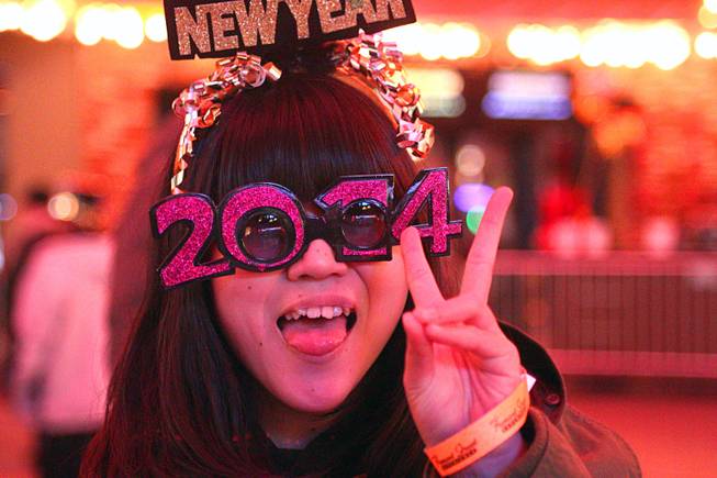 Sakaya of Japan poses during New Year's Eve festivities at the Fremont Street Experience in downtown Las Vegas Tuesday, Dec. 31, 2013. An estimated 335,000 tourists were expected to visit Las Vegas to celebrate the new year.