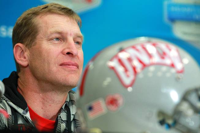 UNLV head coach Bobby Hauck listens to a question during a news conference for the Heart of Dallas Bowl Tuesday, Dec. 31, 2013 at the Cotton Bowl in Dallas.