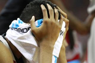 UNLV forward Chris Wood buries his face in a towel during their Mountain West Conference game against Air Force Saturday, Jan. 4, 2014 at the Thomas & Mack Center. Air Force upset UNLV 75-68.
