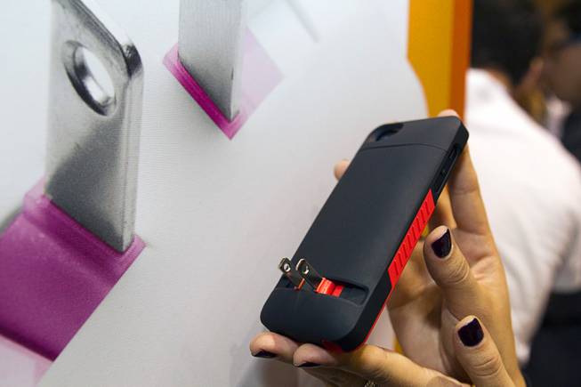 A Prong iPhone case is displayed during "CES Unveiled," a media preview event to the annual Consumer Electronics Show (CES), in Las Vegas, Jan. 5, 2014. The case has a fold-out plug that allows the phone to plug directly into the outlet. The cases retail for $59.95- $69.95 depending on the model.