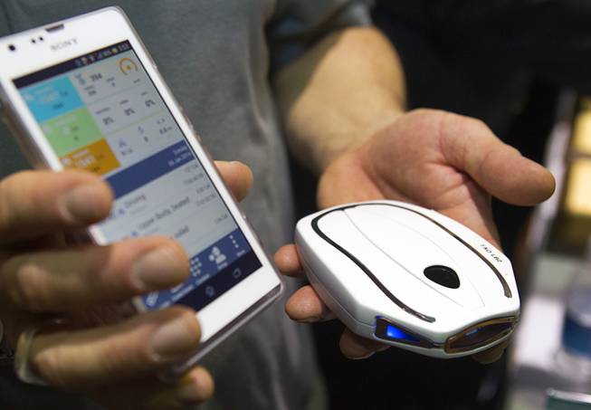 A Tao WellShell is displayed during "CES Unveiled," a media preview event to the annual Consumer Electronics Show (CES), in Las Vegas, Jan. 5, 2014. The WellShell is an electronic isometric device but also monitors various fitness levels and transmits the data to a smartphone.