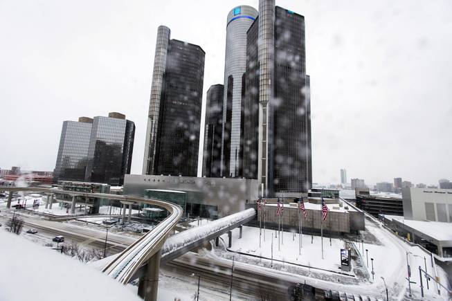 Snow falls on Metro Detroit, Monday, Jan. 6, 2014, in Detroit. A whirlpool of frigid, dense air known as a "polar vortex" descended into much of the U.S. and plunged temperatures to record lows. 