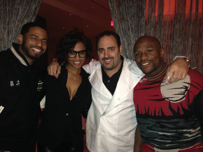 A guest, K.D. Aubert, chef Barry Dakake and Floyd Mayweather Jr. at N9NE Steakhouse in the Palms.