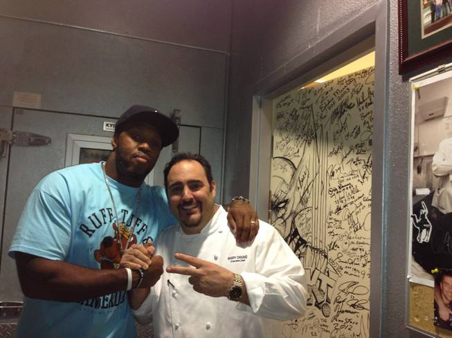 Terrell Suggs and chef Barry Dakake at N9NE Steakhouse in the Palms.